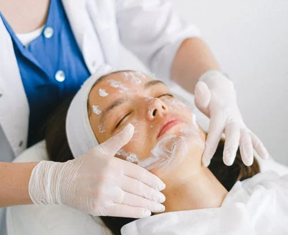 Doctor applying cream