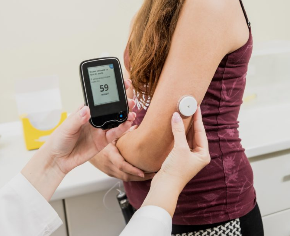 Doctor monitoring blood sugar levels